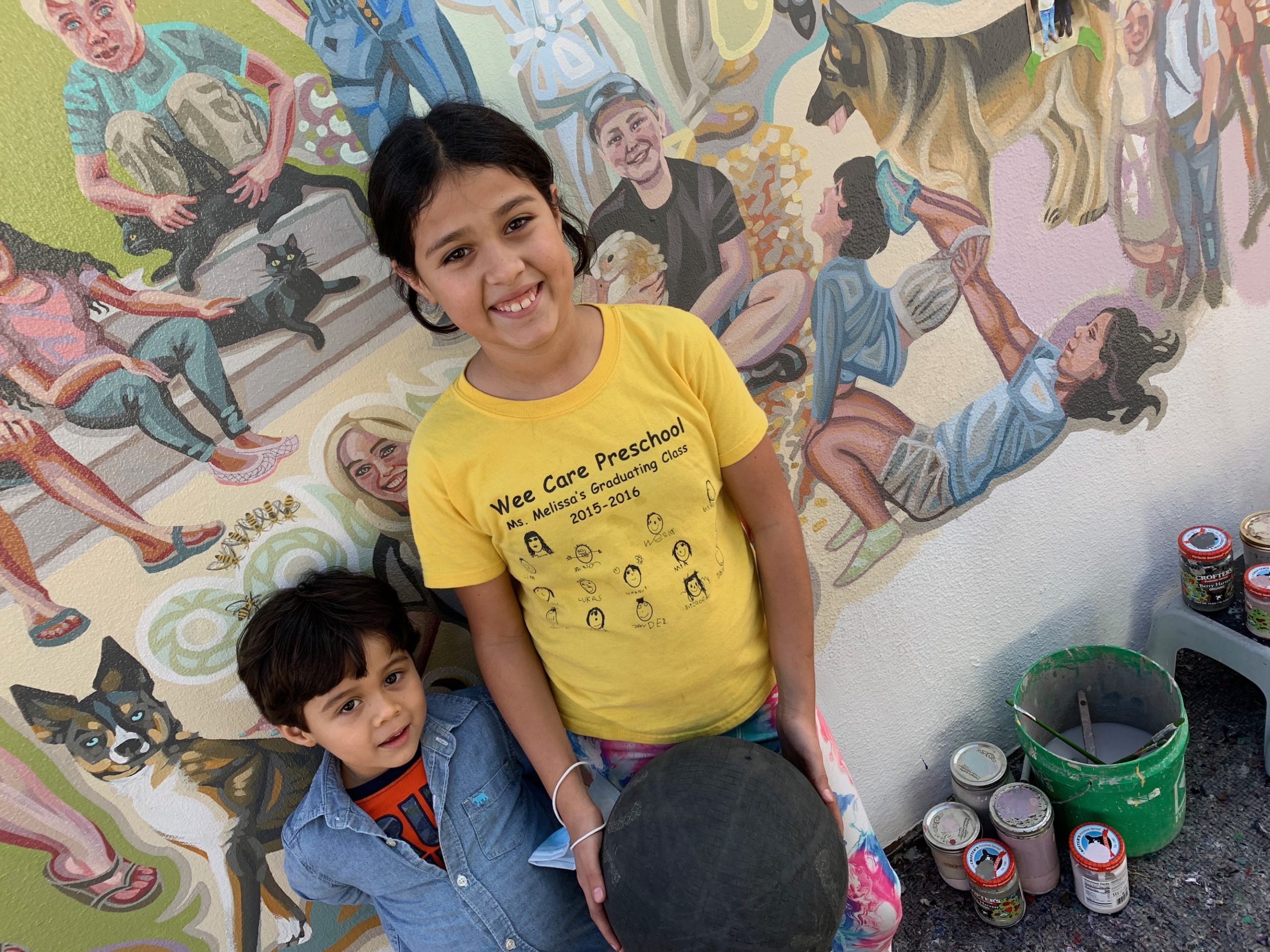 portraits of kids in the mural