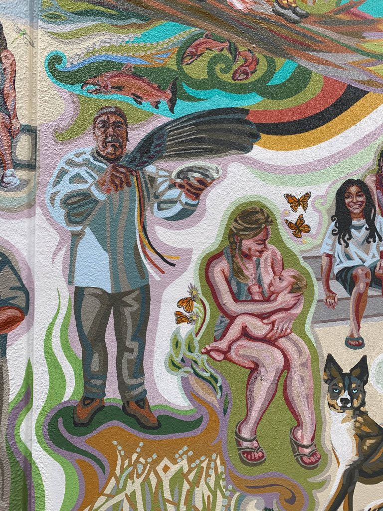 Mural detail of a Native healer, a mother and child, an African-American boy and a dog